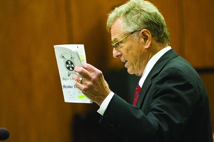 Attorney Morris Dees of the Southern Poverty Law Center show a membership manual distributed by the Imperial Klans of America as he gives his closing argument in a civil suit against the Imperial Klans of America