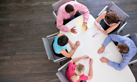 Five businesspeople at boardroom table