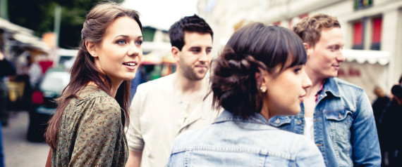 Four young adults in city