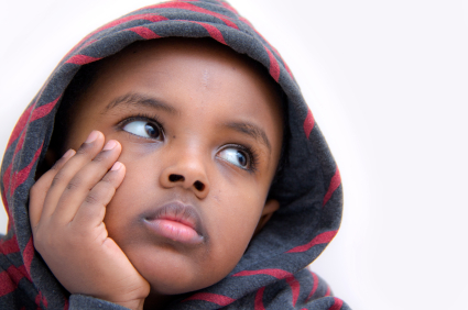 boy looking to the sidethinking