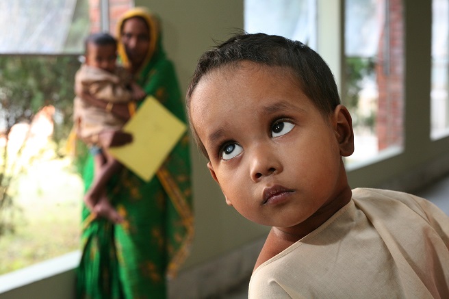 Salima (11) has traveled six hours by bus with her little sister, Halima (4), who suffers from bilateral congenital cataracts. Though only a child herself, the elder sister explains that it is her job to care for her younger siblings as their mother is too pregnant with her tenth child to make the long journey from Cox's Bazaar to Chittagong, the nearest city that has a pediatric eye care facility. 

Halima is at CEITC for her second operation. The cataract blocking vision in her left eye was removed two months ago. Before the procedure, the elder sister explained how Halima would get stuck in corners whenever she tried to walk around unaided.  But child wouldn't cry out for help. She just sat there quietly until someone came along and pointed righted her direction. Even with vision restored in one eye, Halima remains withdrawn and rarely plays with other children. Hopefully the second operation will empower the sad little girl to open up.  

Dr Abdul Mannan Siker, head of CEITC's pediatric department, believes the family condition is very poor. He removed Halima's cataracts free of charge and in such a way that no additional surgery and minimal follow-up will be required.  As part of an ongoing ORBIS project to help CEITC build capacity in pediatric ophthalmology, Dr Mannan received an ORBIS-sponsored fellowship at Aravind Eye Hospital, India. 

TO REQUEST A DETAILED CASE STUDY, EMAIL PHOTO@ORBIS.ORG