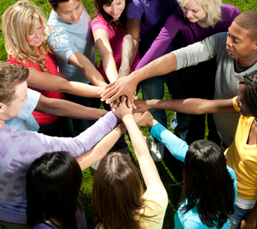 A diverse group of vibrant young adults outside